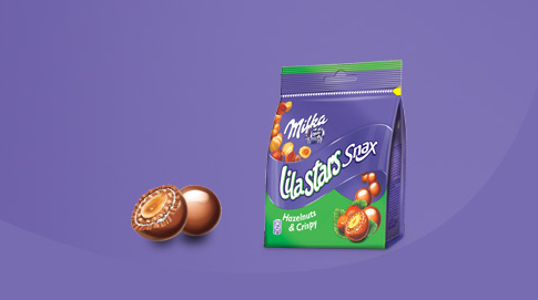 Lila Stars Snax são deliciosas bolinhas de chocolate Milka que escondem no seu interior uma avelã inteira, sob uma capa de cereal estaladiço.